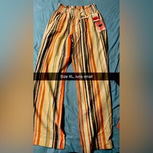 New with tags. Runs small fits more like a med/large
